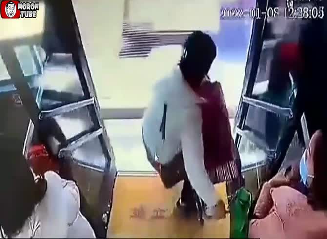 Video :She exits a bus as it is passing!